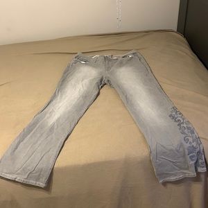 Grey, has a cute design on the bottom